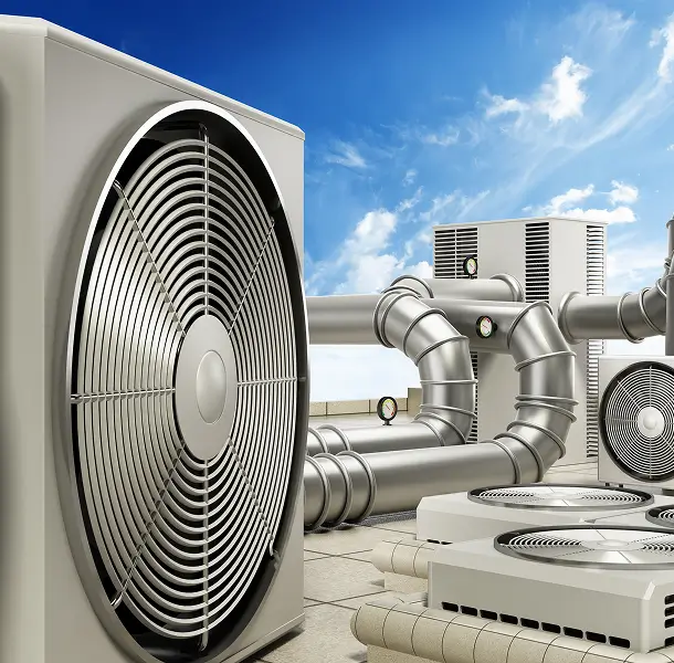 Air conditioning units with pipes and blue sky.